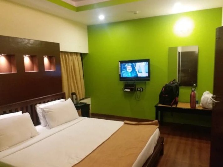 Room with green accent wall